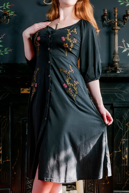 Model posing in black Persephone Summer Dress