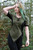 Elven Blade Tunic in Green/Black, front view with hand in hair, paired with Elven Blade Leggings