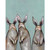 Three Standing Rabbits on Blue Stretched Canvas Wall Art