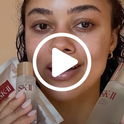 SK-II Pitera Youth Essentials Kit video thumbnail, model holding Facial Treatment Essence and product sachets, skincare set overview for SK-II US product page