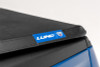 Lund 15-18 Ford F-150 (5.5ft. Bed) Genesis Tri-Fold Tonneau Cover - Black - 950172 Photo - Close Up