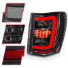 ANZO 1999-2004 Jeep Grand Cherokee LED Tail Lights w/ Light Bar Black Housing Clear Lens - 311394 Photo - Unmounted