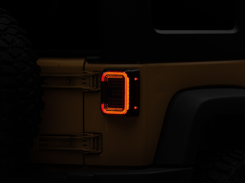 Raxiom 07-18 Jeep Wrangler JK Axial Series LED Halo Tail Lights- Black Housing (Dark Smoked Lens) - J138358