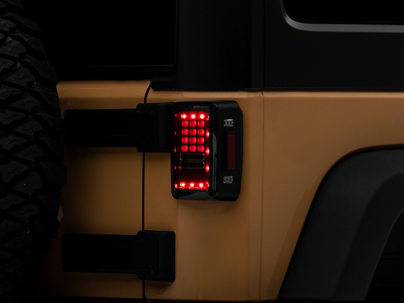 Raxiom 07-18 Jeep Wrangler JK Axial Series LED Tail Lights- Blk Housing (Clear Lens) - J141585