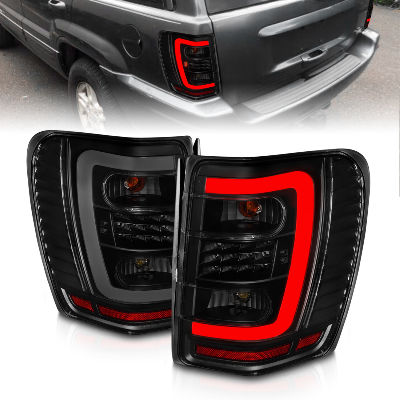 ANZO 1999-2004 Jeep Grand Cherokee LED Tail Lights w/ Light Bar Black Housing Smoke Lens - 311395