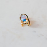gold rounded circular cufflinks with photo of little boy inside