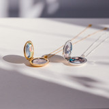 the gold and silver evelyn locket necklace with photos