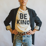 gold edith locket on person wearing "be kind" t shirt