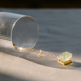 shadowy image of emerald calcite pendant in square gold bezel