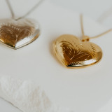 Full Heart Locket — side angle of the engraving done by hand on each of the locket pendants — Locket Sisters