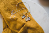 Two silver lockets for mother of the groom and officiant, from the bride.