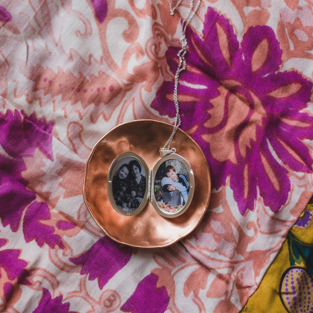 The Evelyn Locket with photos of her two boys. - Locket Sisters