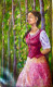Woman In Traditional Attire Standing In A Forest (ART-17757-116400) - Handpainted Art Painting - 12in X 22in