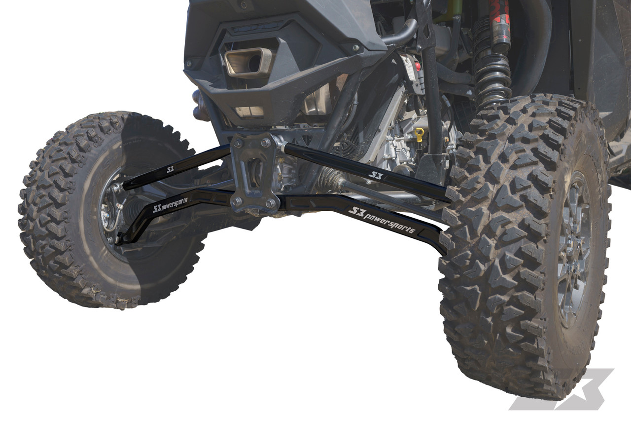 Polaris RZR Pro R Billet Aluminum High Clearance Radius Rods, black branded high-clearance radius rods installed on the rear suspension between the knobby tires of a Polaris RZR Pro R. - S3 Power Sports