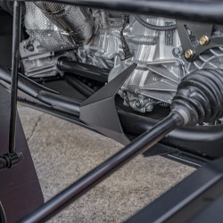 2026 Can-Am Maverick R, close-up of the silver drivetrain housing, black chassis frame, and suspension components