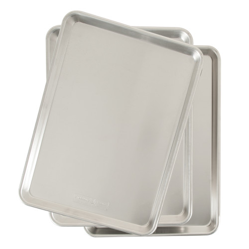 Three Nordic Ware aluminum half sheet baking pans stacked, natural silver finish with raised rims