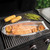 nordic ware seafood griller with salmon and lemon being cooked on grill with corncobs and asparagus 