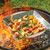 nordic ware grill basket being cooked on grill with shrimp and assorted veggies
