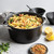 nordic ware 6 qt aluminum dutch oven with pasta with lid in the background