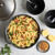 nordic ware 6 qt aluminum dutch oven with pasta with lid in the background