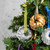 Bundt Ornament Group - a collection of stunning Braided Gold and Silver ornaments beautifully arranged together, showcasing elegance and charm hanging on a christmas tree.