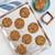Star-shaped gingerbread cookies baked golden brown on Nordic Ware aluminum Naturals Vintage Starburst half sheet pan