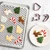 nordic ware half sheet with multi rack and red holiday cookie cutters with decorated cookies