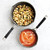 Two Nordic Ware Verde ceramic nonstick skillets (8" and 10") containing soup with golden croutons, overhead view