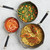 Three Nordic Ware Verde ceramic nonstick skillets in 8", 10", and 12" sizes with tomato soup, sautéed vegetables, and pasta