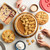 Nordic Ware aluminum pie pans with baked pumpkin pie, mini apple pies, and rectangular pie bars displayed
