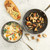 Nordic Ware Basalt non-stick sauce pan with curry soup and sauté skillet with golden mushrooms, overhead view