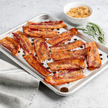 Quarter Sheet & Multi Task Rack with bacon, small dish of brown sugar next to pan