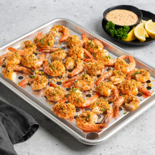 Quarter Sheet & Multi Task Rack with shrimp on rack, sliced lemons next to pan