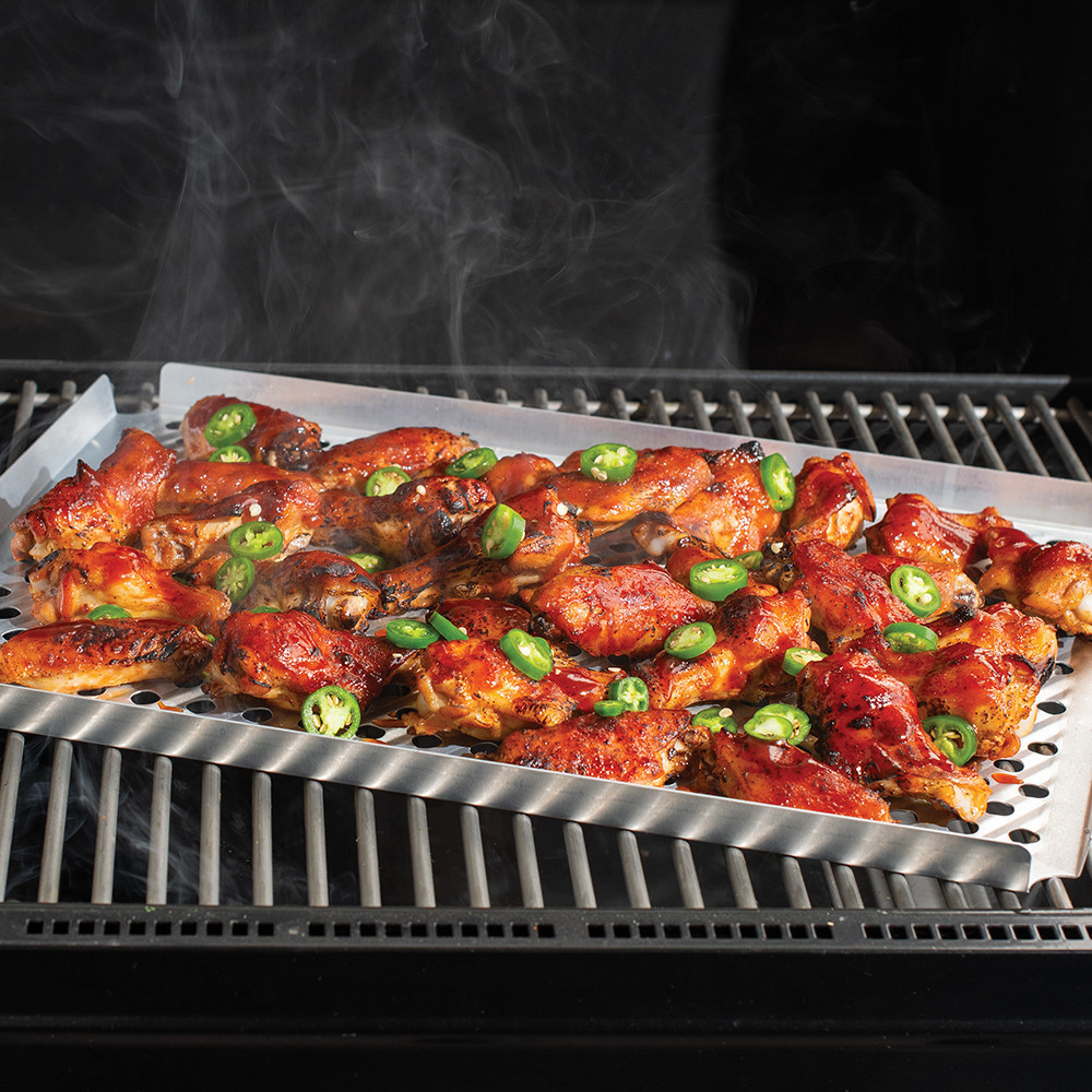 multi purpose rack on grill with chicken wings