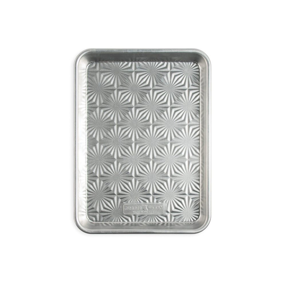 overhead of vintage staruburst quarter sheet pan on white background