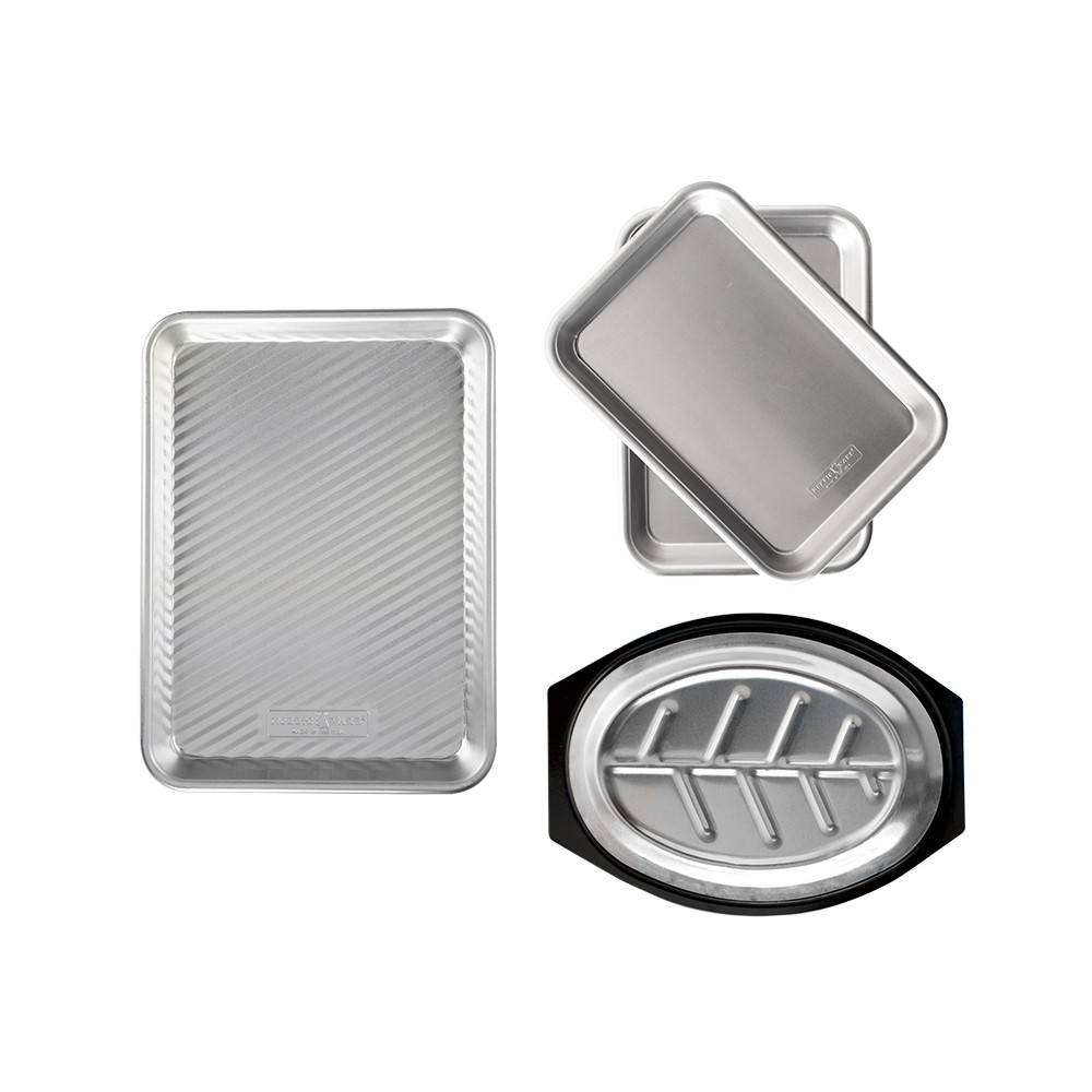 overhead of nordic ware grill prep and serve tray, burger trays, and steak sizzler on white background