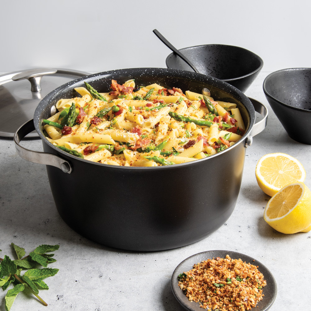 nordic ware 6 qt aluminum dutch oven with pasta with lid in the background