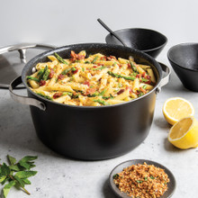 nordic ware 6 qt aluminum dutch oven with pasta with lid in the background