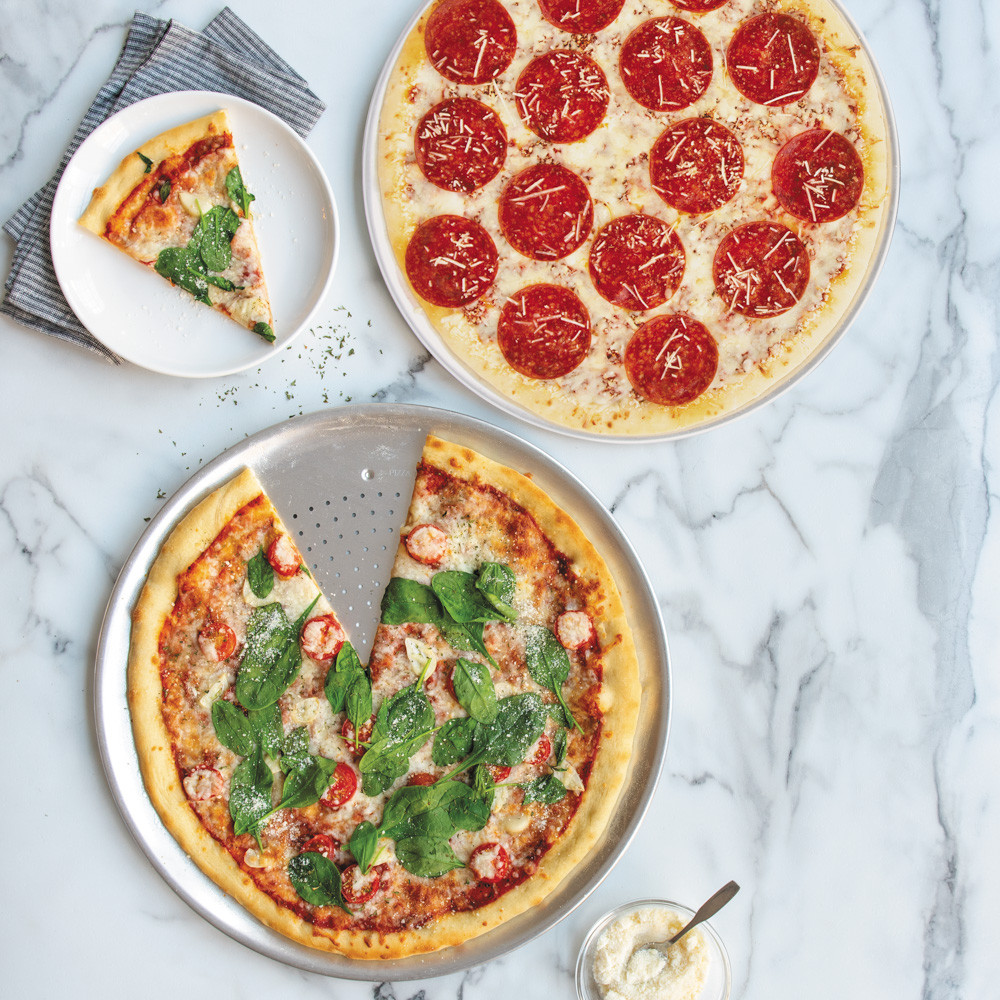 two pizzas on Nordic War perforated Hot Air Crisper Pizza Pans