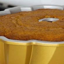 Nordic Ware digital bundt cake thermometer with probe inserted into golden baked bundt cake