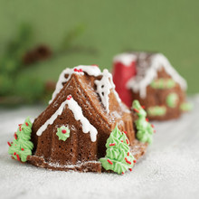 Nordic Ware aluminum gingerbread house duet pan with detailed wall and roof sections, natural silver finish