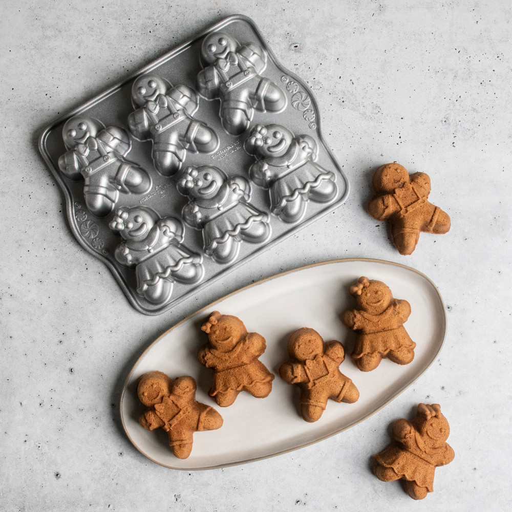 Nordic Ware aluminum gingerbread kids cakelet pan with six child-shaped cavities, natural silver finish