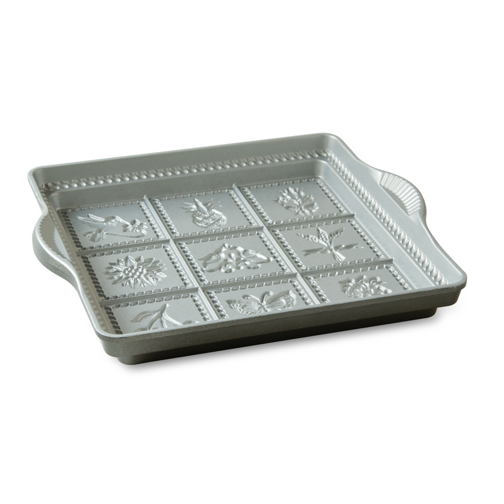 Nordic Ware aluminum shortbread pan with eight triangular wedge sections, natural silver finish, side angle view