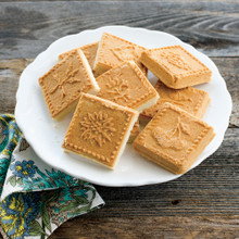 Nine golden shortbread squares baked in Nordic Ware English shortbread pan, showing detailed embossed patterns