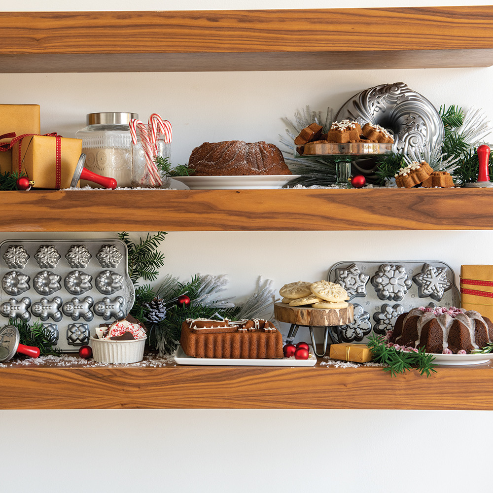 Holiday teacakes baked in Nordic Ware aluminum cakelet pan displayed on festive shelves with winter decorations