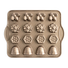 Nordic Ware aluminum bitelet pan with 16 bee-shaped cavities, toffee-colored nonstick coating, overhead view