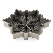 Nordic Ware aluminum snowflake baking pan interior view, silver nonstick coating with detailed snowflake design