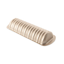 Nordic Ware aluminum loaf pan with detailed cinnamon swirl pattern, rectangular shape, natural silver finish