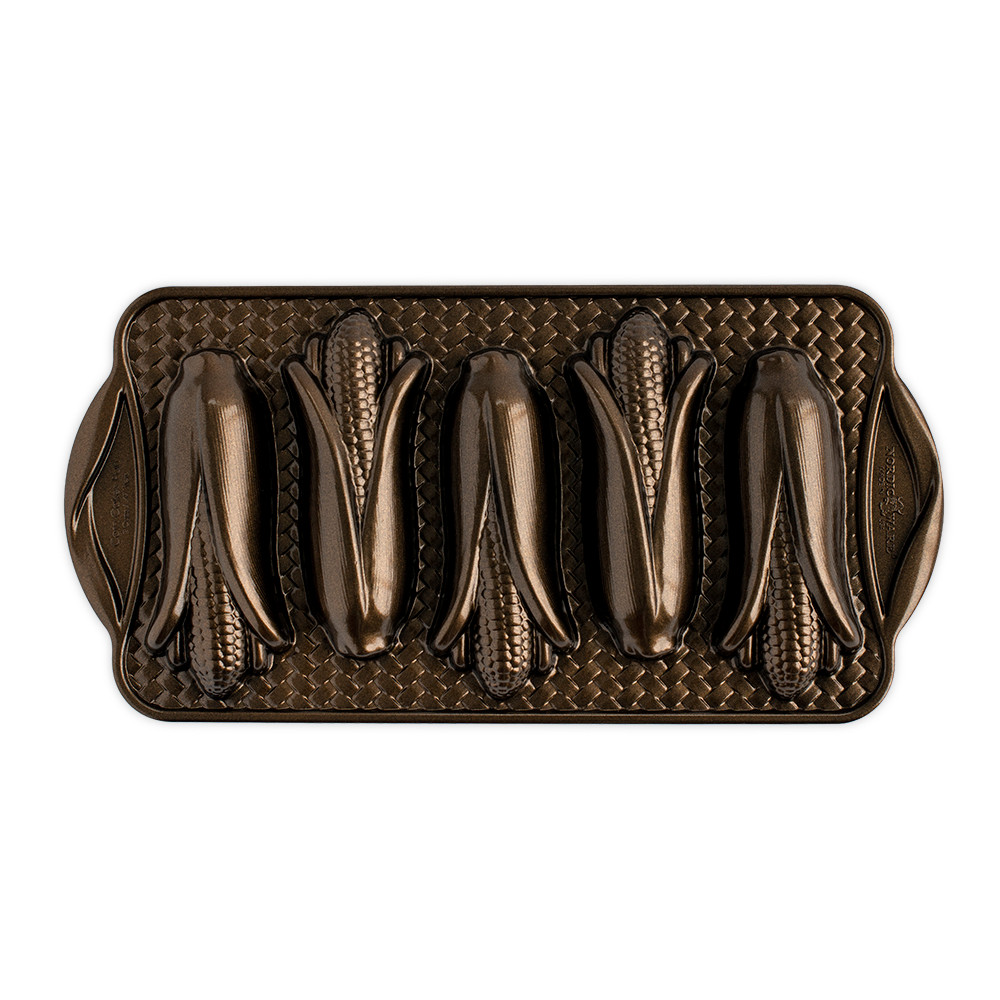 Nordic Ware bronze aluminum corn cakes baking pan with 5 ear-shaped cavities, overhead view