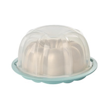 Nordic Ware golden aluminum bundt pan with translucent sea glass dome lid cover, fluted tube design